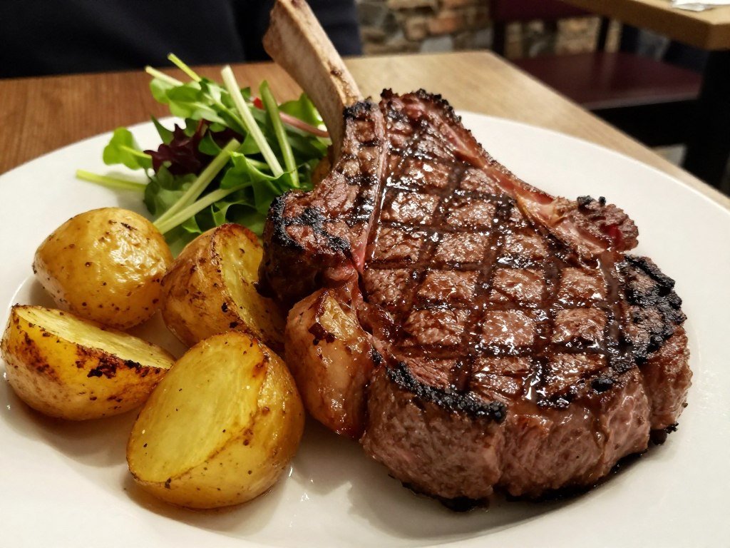 Perfectly grilled ribeye steak at Bij Koen en Marijke, one of the best restaurants in Bruges